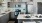 kitchen island with appliances and sink and breakfast bar