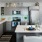 kitchen island with appliances and sink and breakfast bar
