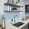 Kitchen sink with floating shelves and modern cabinets