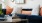 Artistic photo of living couch and coffee table with books and camera