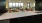Lounge overlooking counter with tables and chairs